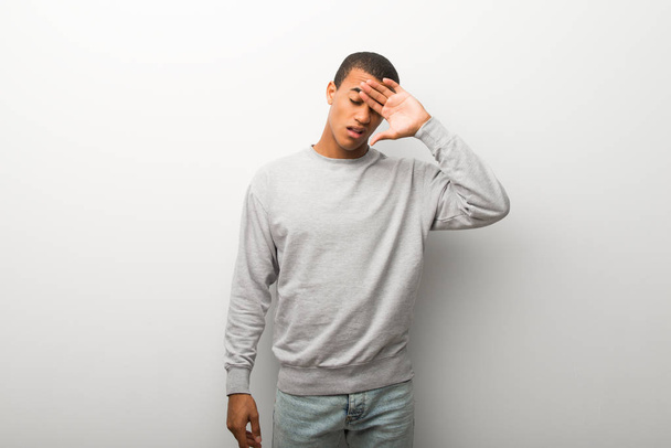 African american man on white wall background with tired and sick expression - Foto, Imagem