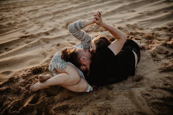 happy couple in love spend good time on the beach and enjoy each other - Fotografie, Obrázek