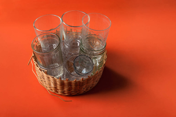 empty glass cups in the basket - 写真・画像