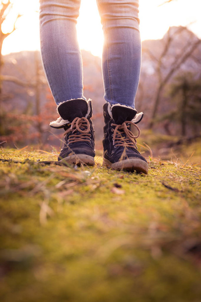 Boots of a young woman, cutout, outdoors in timberland, autumn - Fotoğraf, Görsel