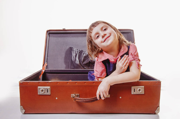 Cute little child girl with vintage suitcase waiting for travel and adventure. Holiday, adventure - Fotografie, Obrázek