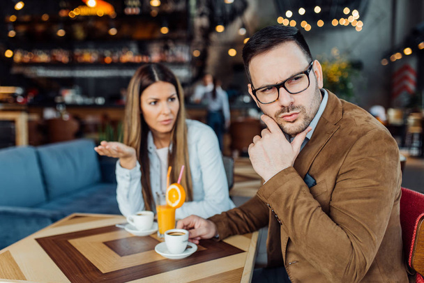 Man flirting with another woman in a bar - Fotografie, Obrázek