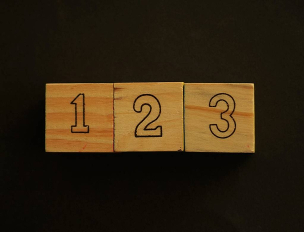 Wooden cubes representing numbers - Фото, зображення