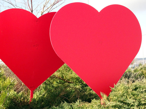 Red Valentine Heart Shapes in a City Park Outdoor - Photo, Image