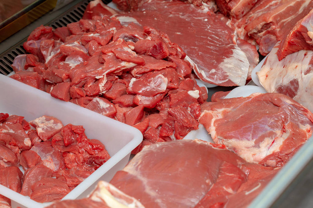 Pork cut into pieces and whole, raw pieces ready to cook - Photo, Image