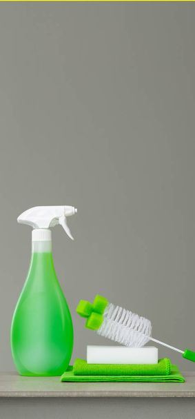 Green set of cleaning products and tools for spring cleaning. - Foto, afbeelding