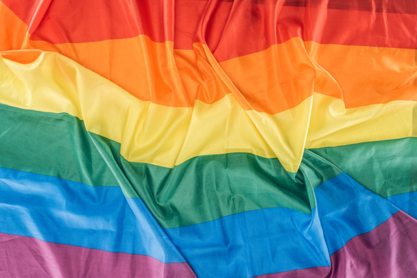 top view of creased rainbow flag, lgbt concept - Zdjęcie, obraz