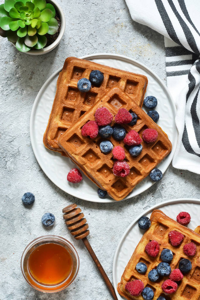 Belgian waffles on a kitchen concrete table. View from above. - Fotó, kép
