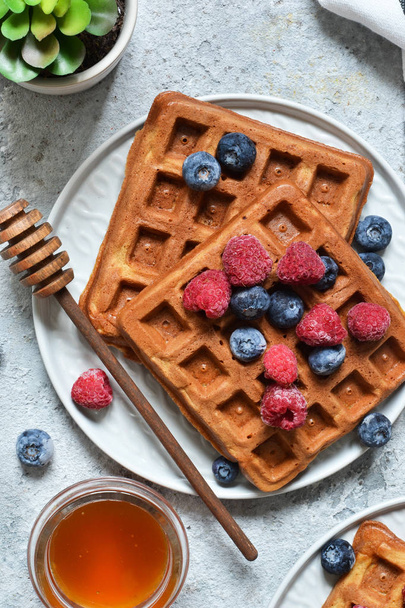 Belgian waffles on a kitchen concrete table. View from above. - Foto, Imagen