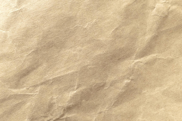 Bruin verfrommeld papier textuur voor achtergrond. - Foto, afbeelding