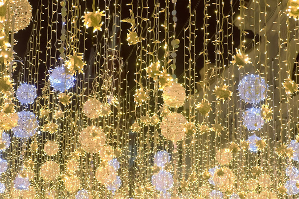 Golden christmas lights beautiful twinkle decorations of street - Φωτογραφία, εικόνα