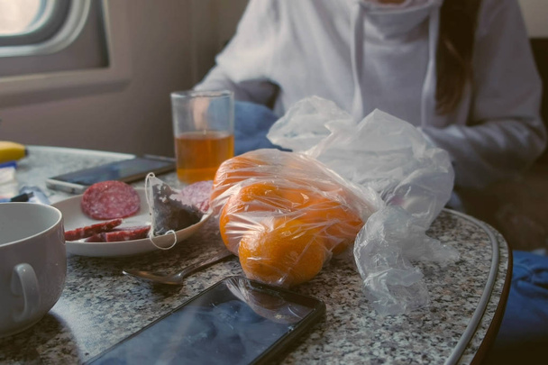 Products on the table in the second-class train carriage. - Fotografie, Obrázek