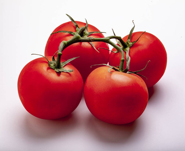 Wet Juicy Tomatoes on the Vine - Фото, зображення
