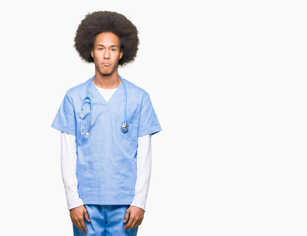 Young african american doctor man with afro hair depressed and worry for distress, crying angry and afraid. Sad expression. - Foto, Bild