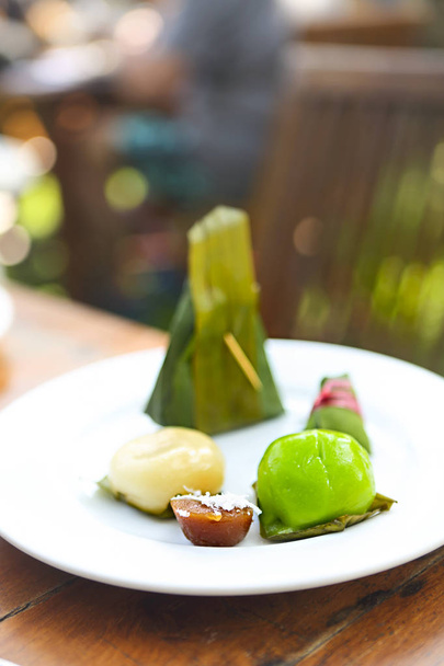 Thai Traditional Desserts, Sticky rice custard wrapped in banana leaves - Photo, image