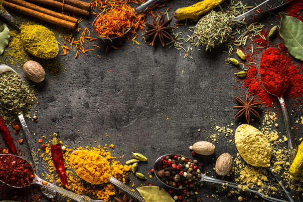 Set of various spices in spoons on black background. - Photo, Image