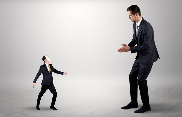 Conflict between small and big businessman - Foto, imagen