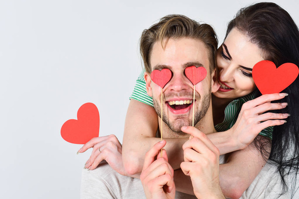 Man and woman couple in love hold red heart valentines cards white background. Valentines day concept. Valentines day and love. Romantic ideas celebrate valentines day. Man and pretty girl in love - Photo, image