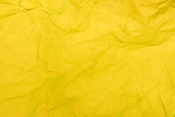 detail of the texture of a yellow plastic bag - Photo, Image