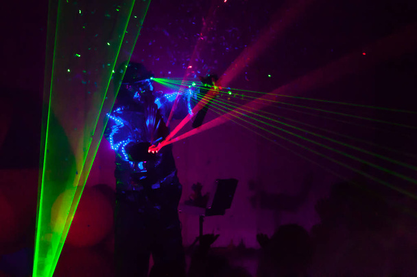 Colorful lights show. Laser show in motion in dark. - Photo, Image