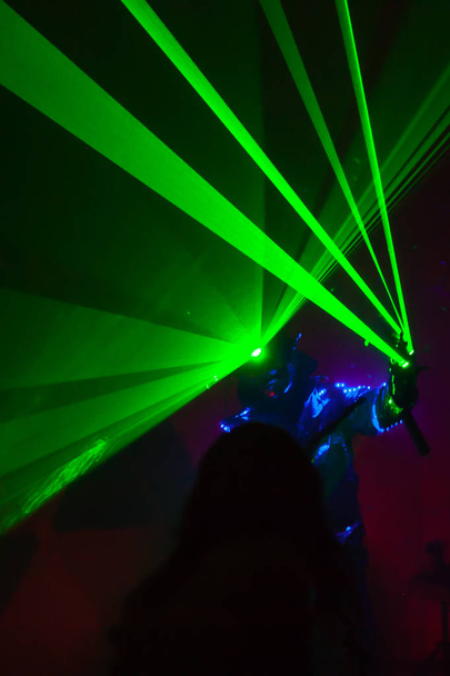 Colorful lights show. Laser show in motion in dark. - Foto, Bild
