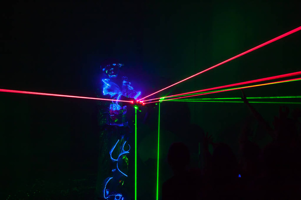 Colorful lights show. Laser show in motion in dark. - Photo, Image