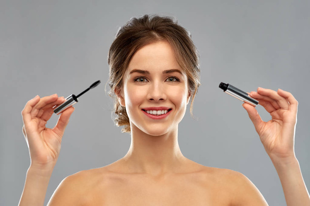 woman with mascara applying make up - Valokuva, kuva