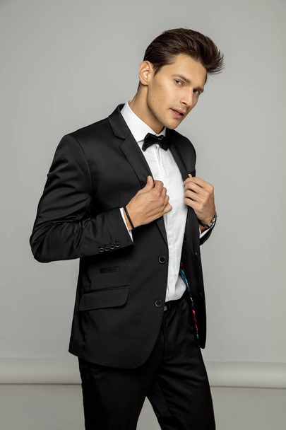 Portrait of handsome man in black suit - Foto, immagini