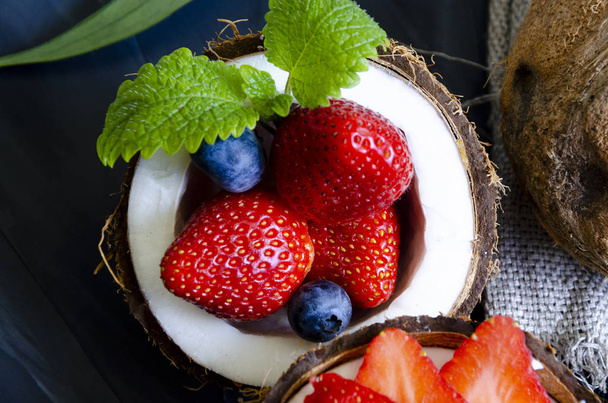 delicate dessert with cream, powdered sugar and berries - Fotó, kép