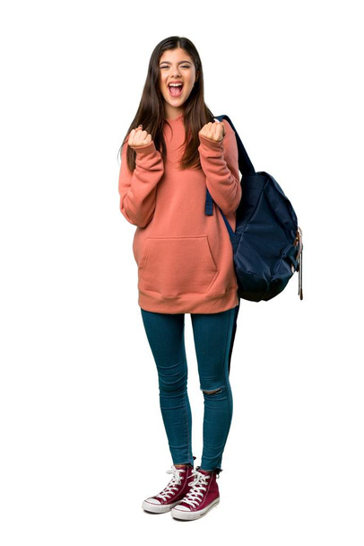 A full-length shot of a Teenager girl with sweatshirt and backpack frustrated by a bad situation - Foto, immagini