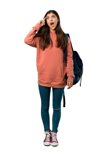 A full-length shot of a Teenager girl with sweatshirt and backpack has just realized something and has intending the solution - Fotoğraf, Görsel
