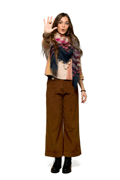 Full-length shot of Young hippie woman counting five with fingers on isolated white background - Foto, immagini