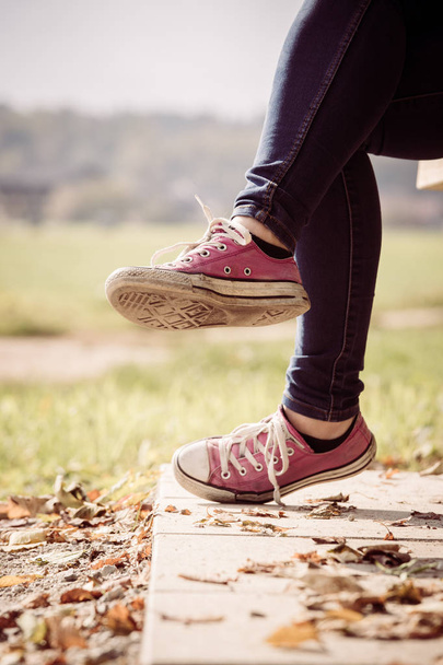 Young girl with pink fashion sneakers, outside - Foto, afbeelding