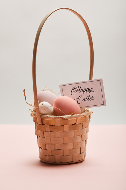 painted easter chicken and quail egg in straw basket, card with happy easter lettering - Fotografie, Obrázek