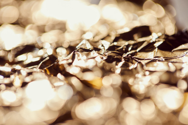 selrctive focus of foil with sparkling lights and twinkles - Foto, Imagem