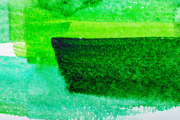 Top view of green watercolor brushstrokes on white paper - Photo, Image