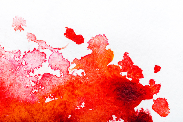 top view of red watercolor spill on white background  - Foto, Bild