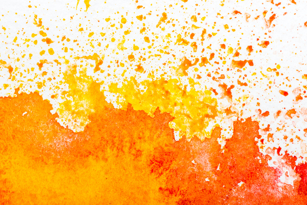 top view of yellow and orange watercolor spills on white background  - Foto, Imagem