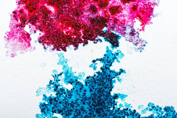 top view of blue and pink watercolor spills on white paper  - Φωτογραφία, εικόνα