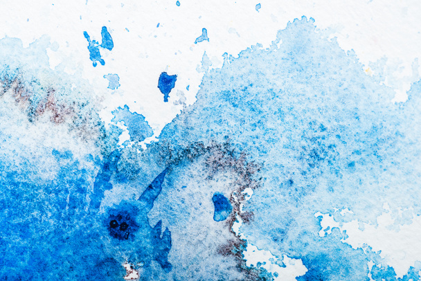 top view of blue watercolor spill on white paper - Photo, Image