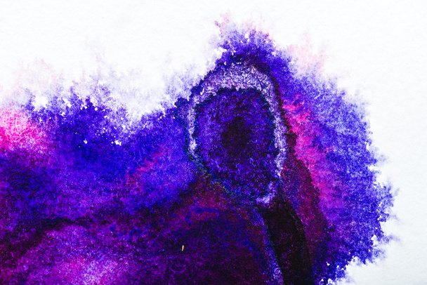 top view of purple and blue watercolor spills on white paper - Fotografie, Obrázek