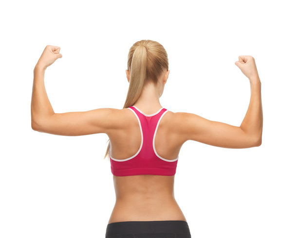 Sporty woman showing her biceps - Фото, зображення