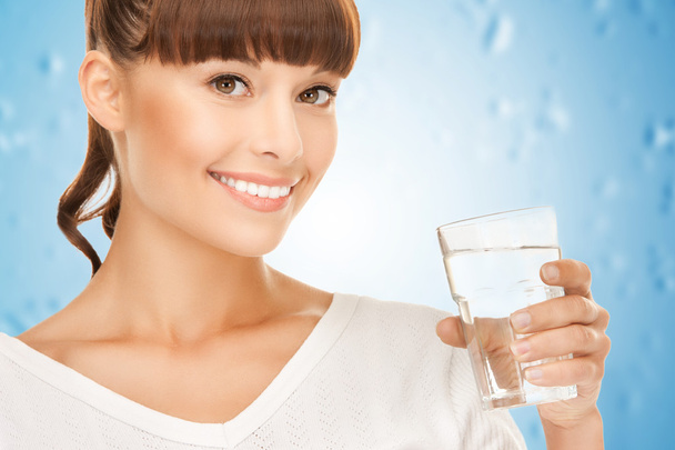 Young smiling woman with glass of water - Foto, Imagen
