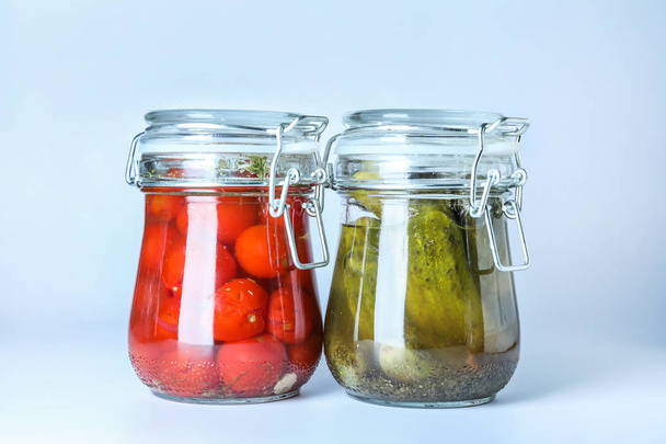Glass jars with fermented vegetables on white background - Photo, Image