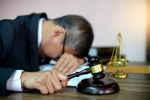Judge lawyer gavel tired and sleeping in office with  balance  in law firm concept  - Zdjęcie, obraz