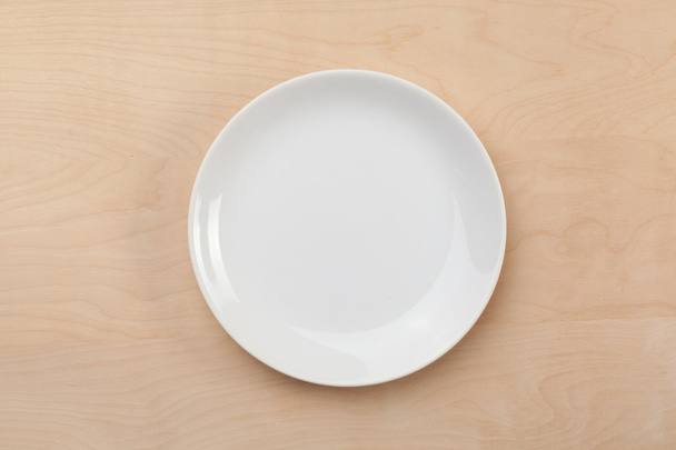 White plate and silver utensil - Photo, image