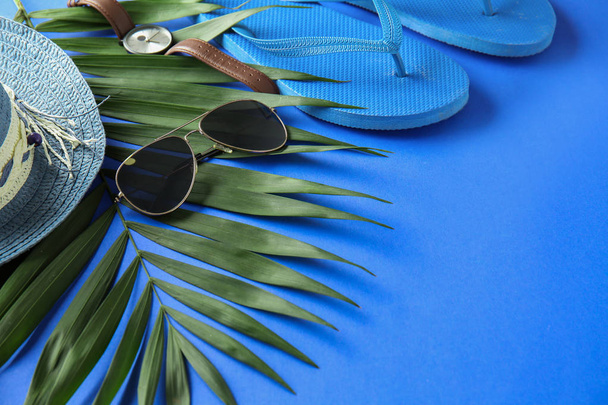Composition with sunglasses and female accessories on color background - Photo, Image