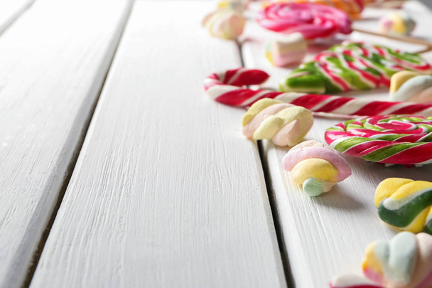 Different sweets on wooden background - Photo, Image