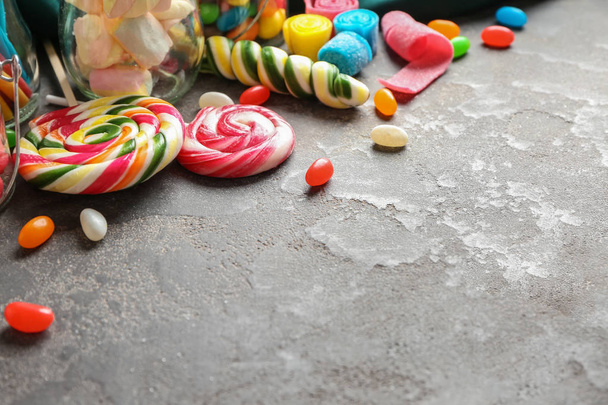 Different sweets on grey background - Photo, Image
