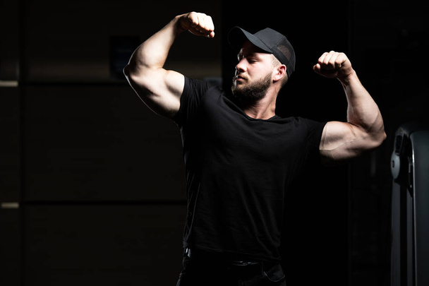 Portrait Of A Young Physically Fit Man Showing His Well Trained Body - Muscular Athletic Bodybuilder Fitness Model Posing After Exercises - Photo, Image